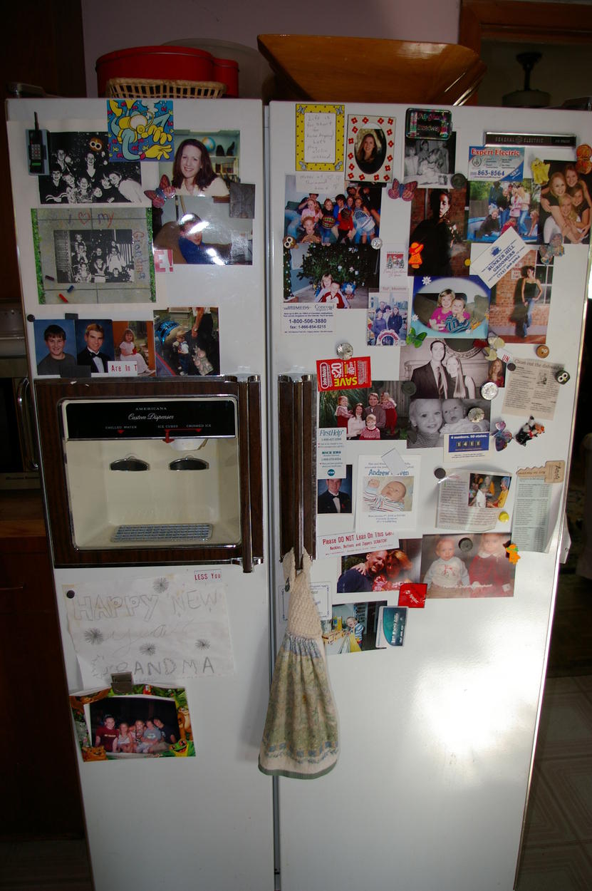 Grandma Barbara's fridge with pictures of all of her grandchildren
