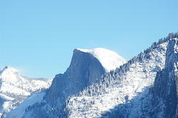 Snow covered Half Dome with banners