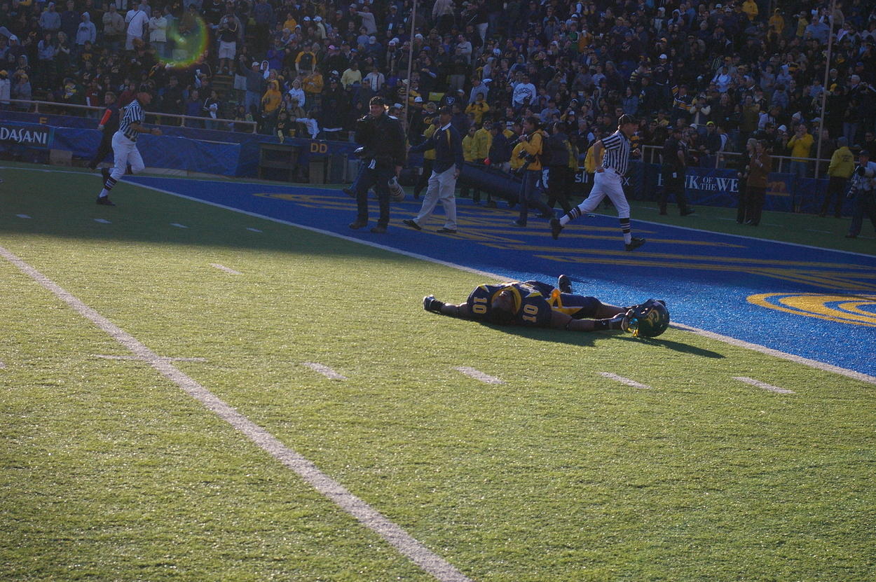 Desmond Bishop lies on ground after his final game in Memorial Stadium