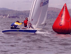 Rounding the mark at the 2005 Elvstrom at the St. Francis YC (how'd he get in front of me?)