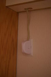 Baby Proofing - Outlet cover with power strip cord coming from channel