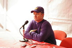 Tedford answers questions in the press "tent"